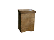 A rustic wooden chest or cabinet with a hinged lid and three front drawers, shown on a plain white background.